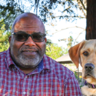 man, yellow lab