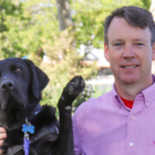 black lab, man, outside