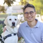 man, yellow lab, guide dog