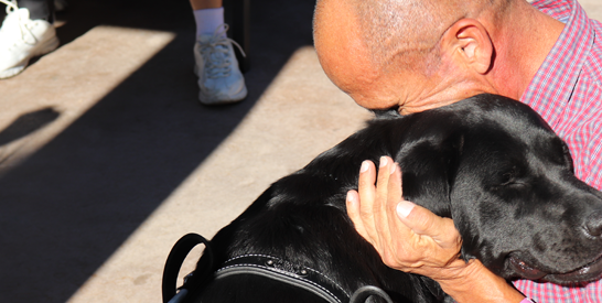 man with service dog