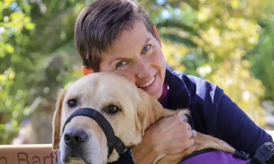 Veteran Woman, service dog, hugging, outside