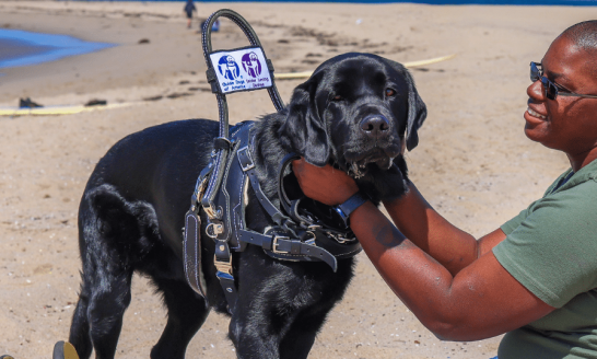 Woman holding her service dog